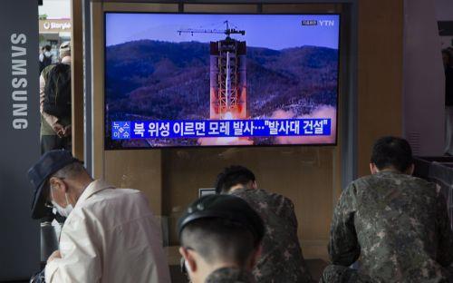 epa10662659 People watch the news at a station in Seoul, South Korea, 30 May 2023. According to the Yonhap news agency, North Korea will launch a military spy satellite in early June.  EPA/JEON HEON-KYUN