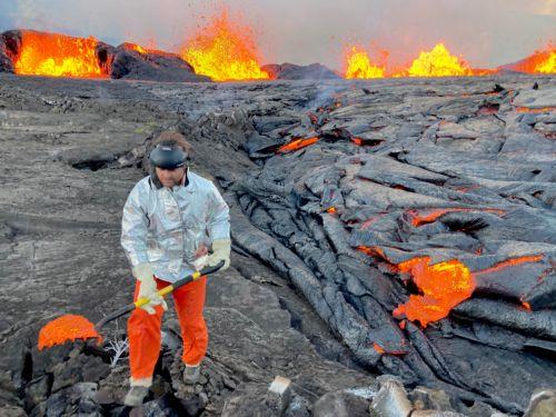 epa10855332 A handout photo made available by the United States Geological Survey (USGS) shows a geologist with the Hawaiian Volcano Observatory collecting lava samples at the KÄ«laueaâ€¯volcano following the volcanoes eruption on 10 September, in Hawaii Volcanos National Park on the island of Hawaii, Hawaii, USA 11 September 2023.  EPA/M. PATRICK / USGS...
