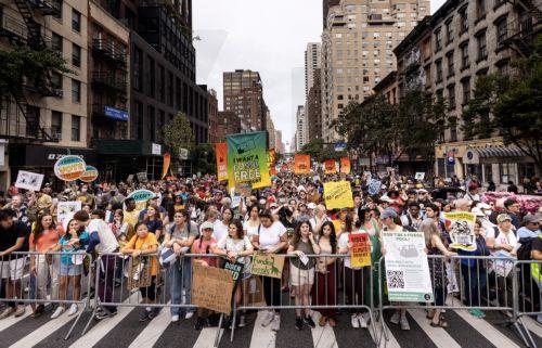 epa10867103 People display signs as they participate in the 'March to End Fossil Fuels', being held in advance of the United Nations' Climate Ambition Summit, in New York City, New York, USA, 17 September 2023. The Climate Ambition Summit 2023, convened by UN Secretary-General Antonio Guterres, will take place at the United Nations headquarters in New York...