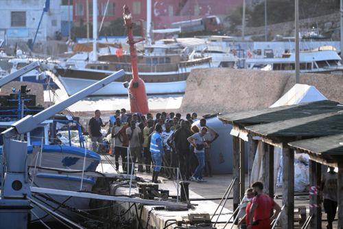 epa10867464 Migrants arrive at 'Molo Favarolo' in Lampedusa, southern Italy, 18 September 2023. Migrants traveling on a small boat were rescued by the Coast Guard. The group, after the health triage, will be transferred to the hotspot where, at the moment, there are 1,104 people.  Italian Deputy Premier and Foreign Minister Antonio Tajani on 15 September...