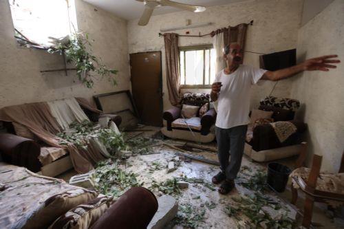 epa10879954 A resident looks at a damaged room in a home at the Nur Shams refugee camp near the West Bank city of Tulkarem, 24 September 2023, following a military operation by the Israeli Army earlier the same day. According to the Palestinian Health Ministry, two Palestinians were killed in the raid in which Israeli forces destroyed the main road and two...