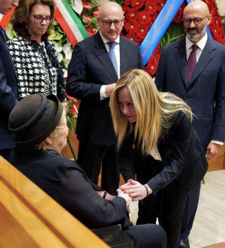 epa10880201 A handout picture made available by the Chigi Palace (Palazzo Chigi) Press Office shows Italian Premier Giorgia Meloni (R) greeting Napolitano's widow Clio (L) at the coffin of late President Emeritus of the Republic Giorgio Napolitano laid in state in the Senate in Rome, Italy, 24 September 2023. Former Italian president Giorgio Napolitano died...
