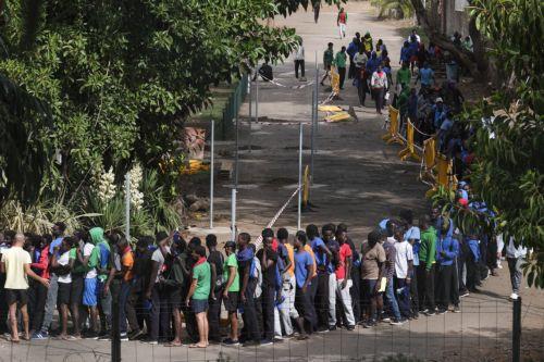 epa10909402 Migrants queue at 'Las Raices' reception center in La Laguna, Tenerife, Canary islands, Spain, 09 October 2023. The named center is housing most of the migrants rescued by Spain's rescue ships. The Canary Islands have received 4,531 migrants in nine days, an unprecedented rate since 2006.  EPA/ALBERTO VALDES