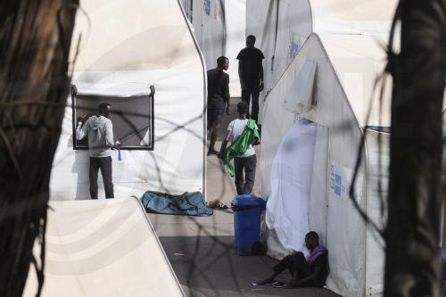 epa10909403 Migrants at 'Las Raices' reception center in La Laguna, Tenerife, Canary islands, Spain, 09 October 2023. The named center is housing most of the migrants rescued by Spain's rescue ships. The Canary Islands have received 4,531 migrants in nine days, an unprecedented rate since 2006.  EPA/ALBERTO VALDES