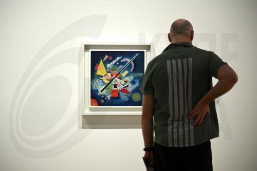 epa10955550 A patron looks at works of art during a media preview of the Sydney International Art Series 2023-24 Vasily Kandinsky exhibition at the Art Gallery of New South Wales in Sydney, Australia, 03 November 2023.  EPA/DAN HIMBRECHTS AUSTRALIA AND NEW ZEALAND OUT