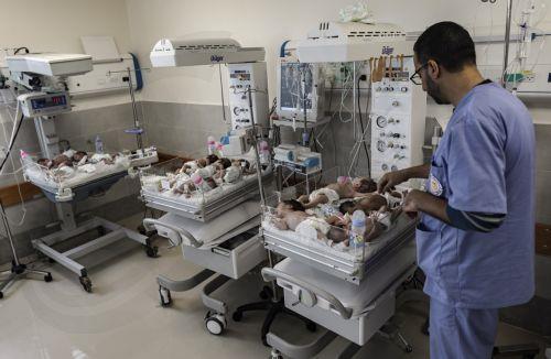 epa10986074 Health personnel prepare premature babies to be transferred to Egypt after they were evacuated from Gazaâ€™s Al-Shifa hospital, at the Emirates Crescent Hospital in Rafah, southern Gaza, 20 November 2023. According to the Palestinian Red Crescent, 28 premature infants were transferred on 20 November from the Emirati Hospital to the Rafah...