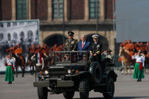 epa10986546 Mexican President Andres Manuel Lopez Obrador flanked by Defense Secretary Luis Cresencio Sandoval (L) and Marine Secretary Rafael Ojeda Duran (R) participate in a parade commemorating the 113 anniversary of the Mexican Revolution, at the Plaza Constitucion Square, in Mexico City, Mexico, 20 November 2023.  EPA/ISAAC ESQUIVEL
