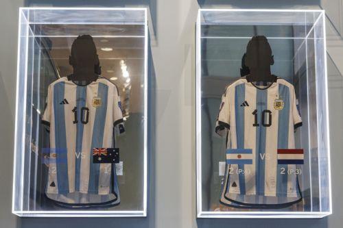 epa11003470 Two of the six match-worn shirts of Argentine soccer player Lionel Messi from the 2022 FIFA World Cup are on display before auction at Sotheby's in New York, New York, USA, 30 November 2023. The set of six shirts will be offered in a dedicated sale open for bidding from 30 November to 14 December.  EPA/SARAH YENESEL