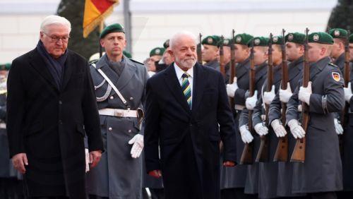 epa11010241 German President Frank-Walter Steinmeier (L) and Brazilian President Luiz Inacio Lula da Silva (R) walk during a reception with Military Honors at Bellevue Palace in Berlin, Germany, 04 December 2023. During his visit to Germany, the Brazilian president meets with the German president and takes part in the second German-Brazilian government...