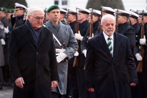epa11010249 German President Frank-Walter Steinmeier (L) and Brazilian President Luiz Inacio Lula da Silva (R) walk during a reception with Military Honors at Bellevue Palace in Berlin, Germany, 04 December 2023. During his visit to Germany, the Brazilian president meets with the German president and takes part in the second German-Brazilian government...