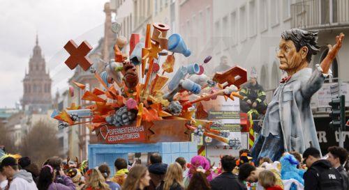 epa11147394 A carnival float depicting German Health Minister Karl Lauterbach is seen during the Rose Monday carnival parade in Mainz, Germany, 12 February 2024. Mainz is one of the carnival strongholds in Germany with its Rose Monday parade jokingly criticising political and social developments. Rose Monday is the traditional highlight of the carnival...