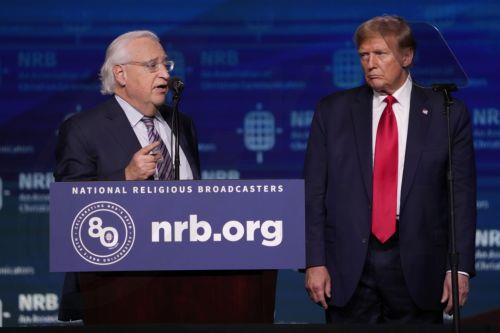 epa11174014 Former President Donald J. Trump (R) listens as David M. Friedman (L), former United States Ambassador to Israel speaks during a presidential forum at the 2024 National Religious Broadcasters International Christian Media Convention in Nashville, Tennessee, USA, 22 February 2024.  EPA/MARK HUMPHREY