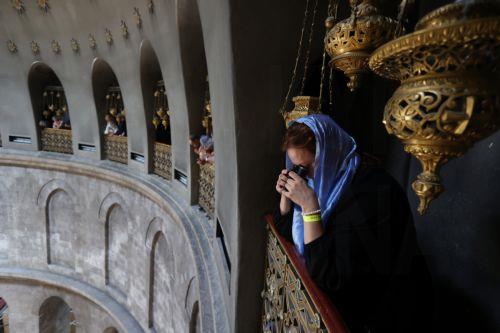 epa11317581 Orthodox Christian worshippers gather at the rooftop above the Tomb of Christ as they wait for the â€˜Holy Fireâ€™ ceremony at the Church of the Holy Sepulchre, in Jerusalem, 04 May 2024. Eastern Orthodox Christians believe that the 'Holy Fire' emanates from within the Tomb of Christ inside the Church of the Holy Sepulcher on the Holy Saturday....
