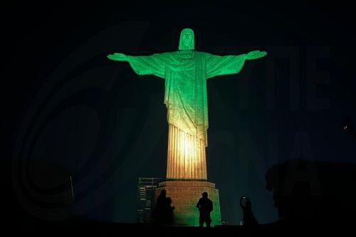 epa11349217 The Christ the Redeemer statue illuminated in green and yellow colors in allusion to the Brazilian soccer team and in celebration of Brazil being chosen to host the Women's Soccer World Cup 2027, in Rio de Janeiro, Brazil, 17 May 2024. The Government of Brazilian President Luiz Inacio Lula da Silva received with 'great satisfaction' the election...