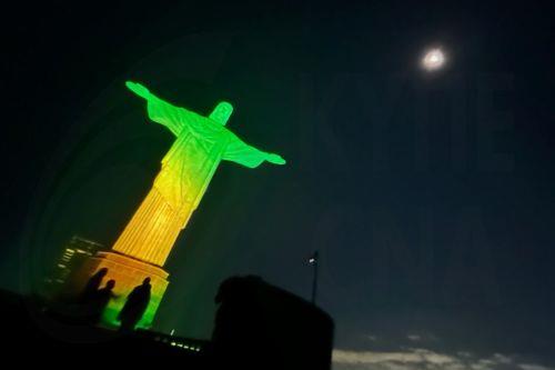 epa11349219 The Christ the Redeemer statue illuminated in green and yellow colors in allusion to the Brazilian soccer team and in celebration of Brazil being chosen to host the Women's Soccer World Cup 2027, in Rio de Janeiro, Brazil, 17 May 2024. The Government of Brazilian President Luiz Inacio Lula da Silva received with 'great satisfaction' the election...