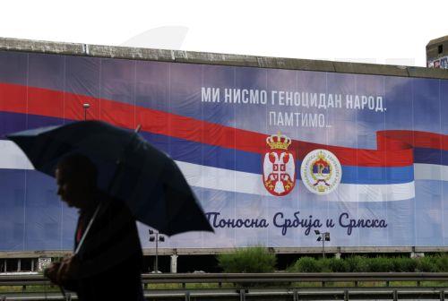 epa11362628 A man walks past a giant billboard reading 'We are not genocidal people. We remember. Proud Serbia and Srpska', in Belgrade, Serbia, 23 May 2024. The United Nations (UN) General Assembly is set to vote on the 'International Day of Remembrance and Commemoration of the Genocide in Srebrenica' resolution on 23 May 2024. Sponsored by Germany and...