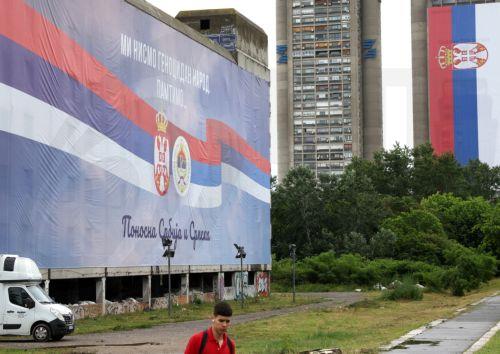 epa11362634 A man walks past a giant billboard reading 'We are not genocidal people. We remember. Proud Serbia and Srpska', in Belgrade, Serbia, 23 May 2024. The United Nations (UN) General Assembly is set to vote on the 'International Day of Remembrance and Commemoration of the Genocide in Srebrenica' resolution on 23 May 2024. Sponsored by Germany and...