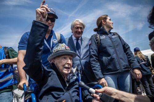 epaselect epa11387362 US WWII veteran Jake Larson speaks to the media as he arrives at Deauville-Trouville airport during a welcome ceremony for the 60 US veterans arriving by a Delta Airlines flight to participate in the 80th anniversary of D-Day landings in Normandy in Deauville Saint Gatien, France, 03 June 2024. World leaders are due to attend memorial...