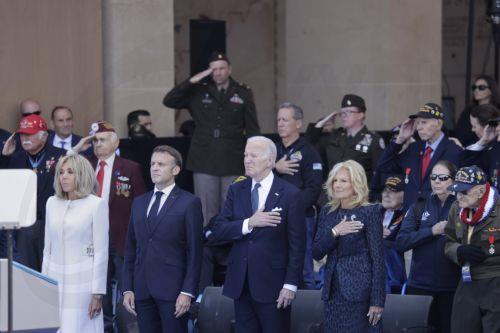 epaselect epa11393010 France's President Emmanuel Macron (2-L), his wife Brigitte (L), US President Joe Biden (2-R) and his wife Dr. Jill Biden (R) attend a commemorative ceremony for the 80th anniversary of D-Day landings in Normandy at American War Cemetery in Colleville-sur-Mer, France on 6 June 2024. More than 160.000 Western allied troops landed on...
