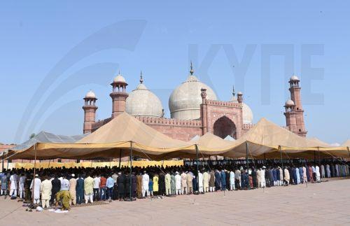 epa11417915 Muslims gather to perform Eid al-Fitr prayers at the historic Badshahi Mosque in Lahore, Pakistan, 17 June 2024. Eid al-Adha is the holiest of the two Muslim holidays celebrated each year. It marks the yearly Muslim pilgrimage (Hajj) to visit Mecca, the most sacred place in Islam. Muslims slaughter a sacrificial animal and split the meat into...