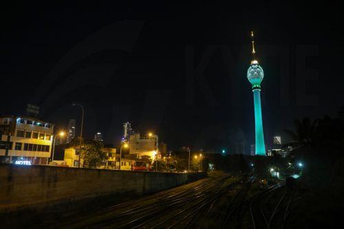 epa11418038 Colombo Lotus Tower is illuminated in green and white to mark the Eid al-Adha festival in Colombo, Sri Lanka, 17 June 2024. Eid al-Adha is the holiest of the two Muslims holidays celebrated each year. It marks the yearly Muslim pilgrimage (Hajj) to visit Mecca, the holiest place in Islam. Muslims slaughter a sacrificial animal and split the meat...
