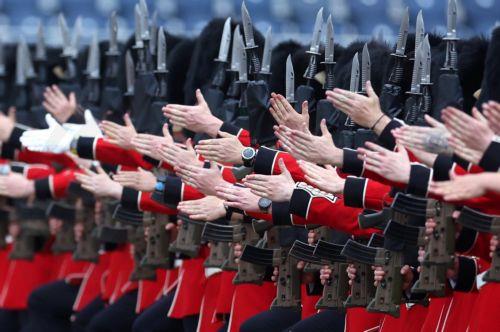 epa11436145 Members of Britain's armed forces take part in a ceremonial welcome for the Emperor and Empress of Japan at Horseguards Parade in London, Britain, 25 June 2024. Emperor Naruhito and Empress Masako of Japan are undertaking a three day state visit to the UK.  EPA/NEIL HALL