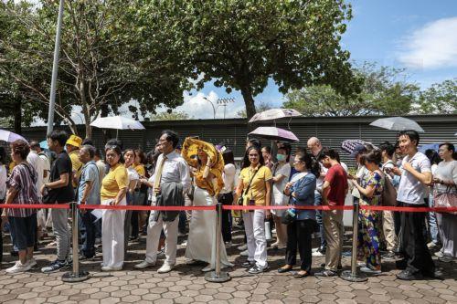 epa11599607 People queue to enter the National Stadium ahead of the Holy Mass led by Pope Francis (not pictured), in Singapore, 12 September 2024. Pope Francis is visiting Singapore from 11 to 13 September, marking the final stop of his apostolic journey through the Asia-Pacific region, which also included Indonesia, Papua New Guinea, and East Timor. ...