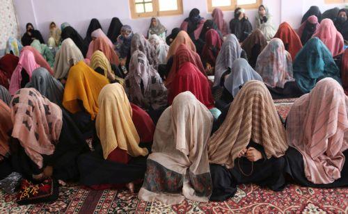 epa11605321 Brides in veils sit on the floor as they wait during a mass marriage ceremony, in Srinagar, the summer capital of Indian Kashmir, 15 September 2024. A total of 60 orphan girls and low-income couples got married during a mass ceremony organized by the non-governmental organization (NGO) 'J&K Al Noor Yateem Trust' to provide financial support to...