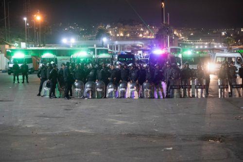 epa11608886 Moroccan public security forces deploy near a customs checkpoint along the land border with the Spanish enclave of Ceuta, in Fnideq, northern Morocco, 16 September 2024. Hundreds of migrants on 15 September stormed a barbed wire fence to cross the land border from Fnideq to Ceuta, following a call on social media for a mass migration attempt,...