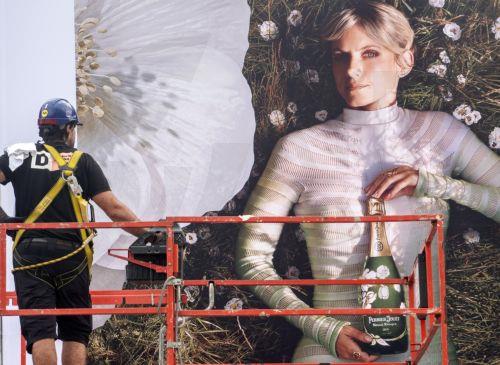 epa11611265 A worker places a banner during preparations for 72th San Sebastian International Film Festival (SSIFF) in the city of San Sebastian, Basque Country, northern Spain, 18 September 2024. The festival runs from September 20 to 28.  EPA/Javier Etxezarreta