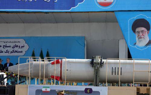 epa11616809 A truck carrying the Iranian missile Jahad passes by a picture of Iranian Supreme Leader Ayatollah Ali Khamenei during the annual military parade marking the Iraqi invasion in 1980, which led to an eight-year-long war (1980-1988); in Tehran, Iran, 21 September 2024. According to IRNA newes agency, Iranian president Masoud Pezeshkian said 'our...