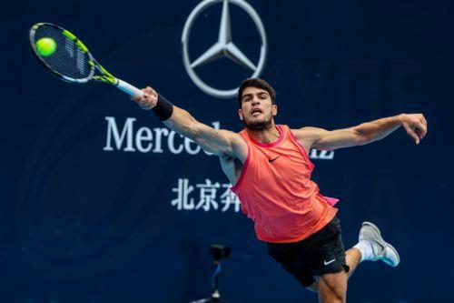 epa11627958 Carlos Alcaraz of Spain in action during his Men's Singles first round match against Giovanni Mpetshi Perricard of France in the China Open tennis tournament in Beijing, China, 27 September 2024.  EPA/WU HAO