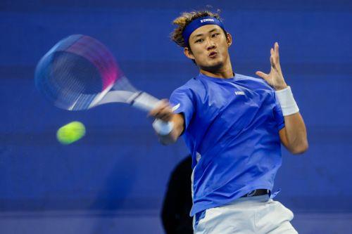 epa11628593 Zhizhen Zhang of China in action during his Men's Singles first round match against Alejandro Davidovich Fokina of Spain in the China Open tennis tournament in Beijing, China, 27 September 2024.  EPA/WU HAO