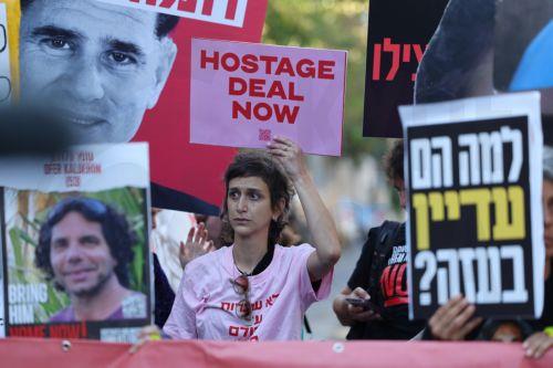 epa11633291 A woman holds a sign during a march towards Israeli Prime Minister Netanyahuâ€™s residence, calling for a ceasefire and for the release of Israeli hostages held by Hamas in Gaza, in Jerusalem, 30 September 2024. According to the Israeli military, at least 100 Israeli hostages remain in captivity in the Gaza Strip, including the bodies of at...