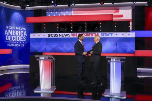 epa11636942 Republican vice presidential nominee JD Vance (L), and Minnesota Governor and Democratic vice presidential nominee Tim Walz (R) shake hands before the start of the Vice Presidential debate at the CBS Broadcast Center in New York, New York, USA, 01 October 2024.  EPA/SARAH YENESEL