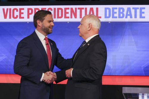 epa11636944 Republican vice presidential nominee JD Vance (L), and Minnesota Governor and Democratic vice presidential nominee Tim Walz (R) shake hands before the start of the Vice Presidential debate at the CBS Broadcast Center in New York, New York, USA, 01 October 2024.  EPA/SARAH YENESEL