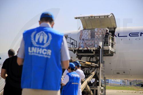 epaselect epa11641316 Workers carry out aids, medicines, and medical supplies provided by the World Health Organization (WHO) from a plane at Beirut airport, in Beirut, Lebanon, 04 October 2024. Lebanese Minister of Health, Firas Abiad, announced on 03 October, that 1,974 people have been killed, including 127 children and 261 women, and 9,384 others have...