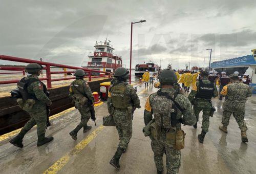 epa11650032 Members of the Mexican Navy and Army carry out a tour to assess the damage caused by Hurricane Milton, in Cancun, Mexico, 08 October 2024. Hurricane Milton, which in the last hours intensified and reached category 5 storm, moved away from the coasts of the southern state of Quintana Roo, with no casualties or injuries reported in the main...
