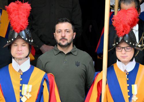 epa11654279 Ukrainian President Volodymyr Zelensky (C) is flanked by Swiss Guards as he leaves after a private audience with Pope Francis (not pictured) at the San Damaso courtyard in the Vatican City, 11 October 2024. Zelensky is visiting the Vatican for the third time after holding talks with the pontiff in 2020 and 2023.  EPA/ETTORE FERRARI