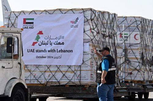 epa11658028 Workers unload relief supplies provided by the United Arab Emirates at Beirut airport, in Beirut, Lebanon, 14 October 2024. The United Arab Emirates launched the nationwide campaign 'UAE Stands with Lebanon' running from 13 to 21 October to gather supplies for the people of Lebanon. According to the Lebanese Ministry of Health, more than 2,300...