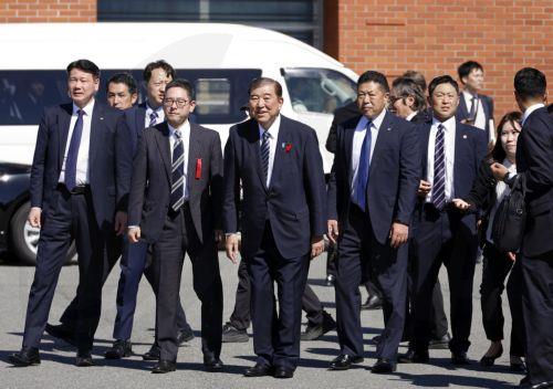 epa11659875 Japanese Prime Minister Shigeru Ishiba (C) bows to attendees after delivering a stump speech for a ruling Liberal Democratic Party (LDP) candidate during an election campaign rally at Onahama Fish Market in Iwaki, Fukushima prefecture, northeastern Japan, 15 October 2024. Prime Minister Ishiba made his first speech at the kick-off of the...