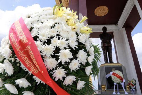 epa11659932 Flower wreaths are placed at the statue of late Cambodian King Norodom Sihanouk during a ceremony to mark the 12th anniversary of the monarch's death, in Phnom Penh, Cambodia, 15 October 2024. The former Cambodian king died on 15 October 2012 at the age of 89 in Beijing, China.  EPA/KITH SEREY