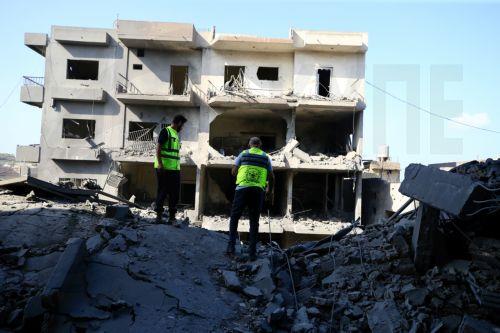 epa11662056 Rescuers work at the site of an Israeli military strike in Qana town, southern Lebanon, 16 October 2024. According to Lebanon's National News Agency (NNA), at least 10 people were killed and 15 others injured after Israeli warplanes hit the southern Lebanese town of Qana on the evening of 15 October. According to the Lebanese Ministry of Health,...
