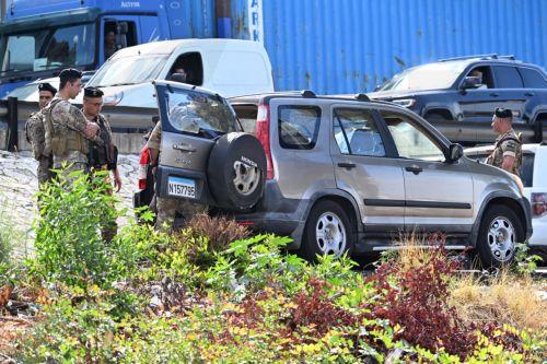 epa11668086 Lebanese soldiers inspect the site of a drone attack in Sahel Alma, north Beirut, Lebanon, 19 October 2024. According to Lebanon's National News Agency (NNA), two people were killed after an Israeli drone targeted their car on the Jounieh highway before pursuing them in the forest adjacent to the highway. Two others were injured in the attack...