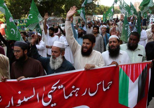 epa11668210 Supporters of the Pakistan Markazi Muslim League shout slogans as they gather for an absentee funeral prayer for Hamas leader Yahya Sinwar killed in Gaza, in Karachi, Pakistan, 19 October 2024. The Israeli Army, Tsahal, on 17 October 2024 confirmed that Hamas leader Yahya Sinwar was 'eliminated' on 16 October 'after a year-long pursuit'. ...