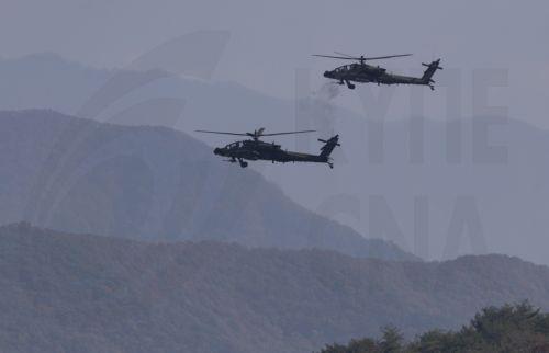 epa11691746 US AH-64E Apaches take part in the 2nd Combat Aviation Brigade, 2nd Infantry Division/Republic of Korea (ROK) - United States Combined Division, live-fire drills with the 901st Aviation Battalion of the South Korea Army at Rodriguez live fire range in Pocheon, South Korea, 30 October 2024.  EPA/JEON HEON-KYUN