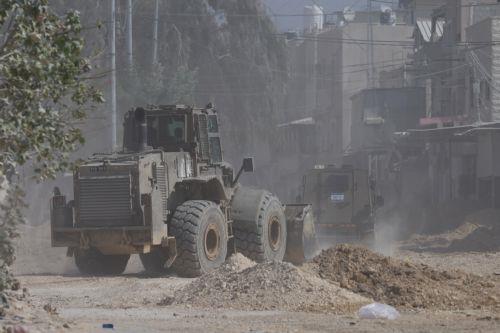 epaselect epa11693882 An Israeli bulldozer during an Israeli army raid in the Nur Shams refugee camp near the West Bank city of Tulkarem, 31 October 2024. According to the Palestinian Health Ministry in the West Bank at least three Palestinians were killed in the raid. The Israeli army said it was a counterterrorism operation. Since 07 October 2023, over...