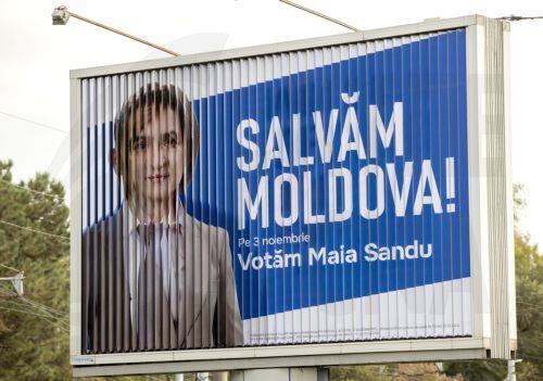 epa11694909 A prismatron displays during rotation both election billboards of candidates for presidential elections Moldovan President Maia Sandu and and former prosecutor general Alexandr Stoianoglo with the slogan 'Let's save Moldova' in Chisinau, Moldova, 31 October 2024. Moldova will hold the second round of presidential election, between incumbent...
