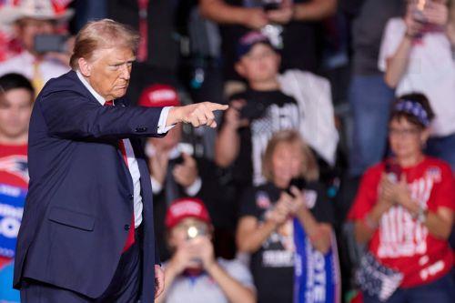 epa11695166 Former US President and Republican Presidential candidate Donald J. Trump points to supporters during a campaign event at Lee's Family Forum in Henderson, Nevada, USA, 31 October 2024.  EPA/ALLISON DINNER