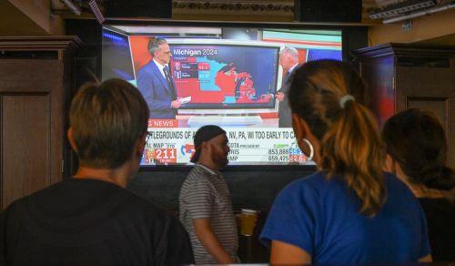 epa11704496 People are seen watching the election coverage at the Democrats Abroad 2024 US election watch party at the Pig N' Whistle Pub in Brisbane, Australia, 06 November 2024. Americans will pick either Vice President Kamala Harris or former president Donald Trump as the US election campaign comes to a head.  EPA/DARREN ENGLAND  AUSTRALIA AND NEW...